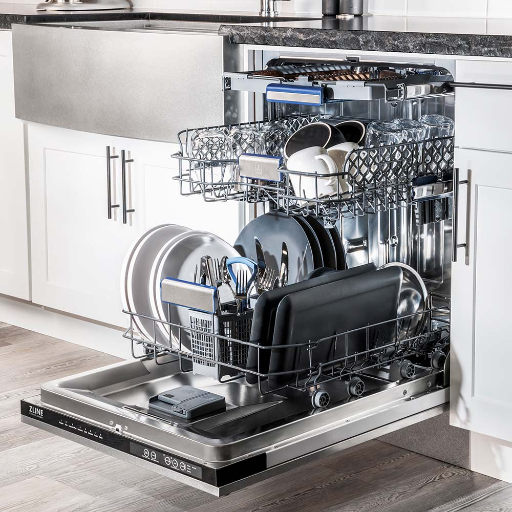 ZLINE 24 in. Tallac Series 3rd Rack Dishwasher with Fingerprint Resistant Stainless Steel Panel and Traditional Handle 51dBa (DWV-SN-24) side, open, in a luxury kitchen with dishes loaded on racks.