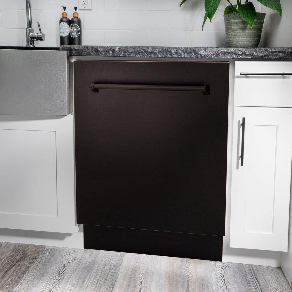 ZLINE 24 in. Tallac Series 3rd Rack Dishwasher with Oil-Rubbed Bronze Panel and Traditional Handle, 51dBa (DWV-ORB-24) in a kitchen with white cabinets and stone countertops.