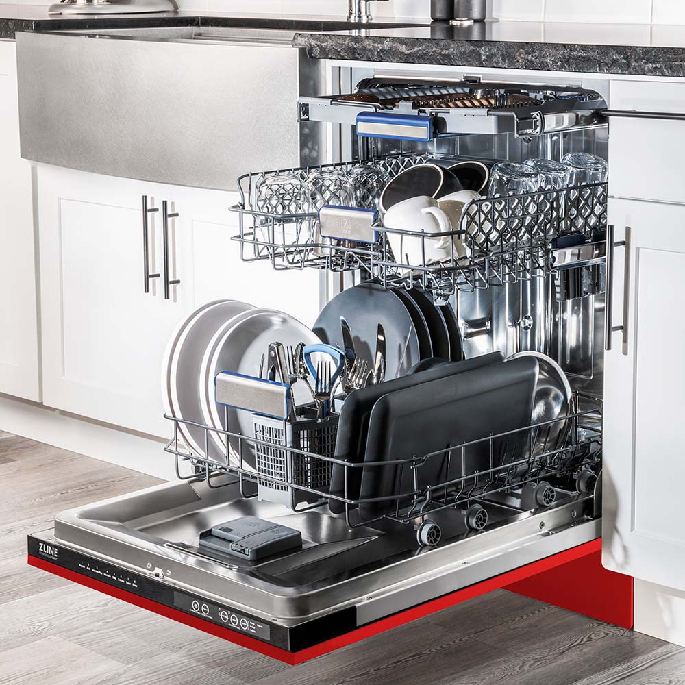 ZLINE 24 in. Tallac Series 3rd Rack Dishwasher with Red Matte Panel and Traditional Handle, 51dBa (DWV-RM-24) side, open, in a luxury kitchen with dishes loaded on racks.