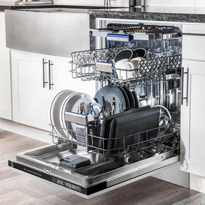 Stainless steel panel dishwasher loaded with dishes in luxury kitchen