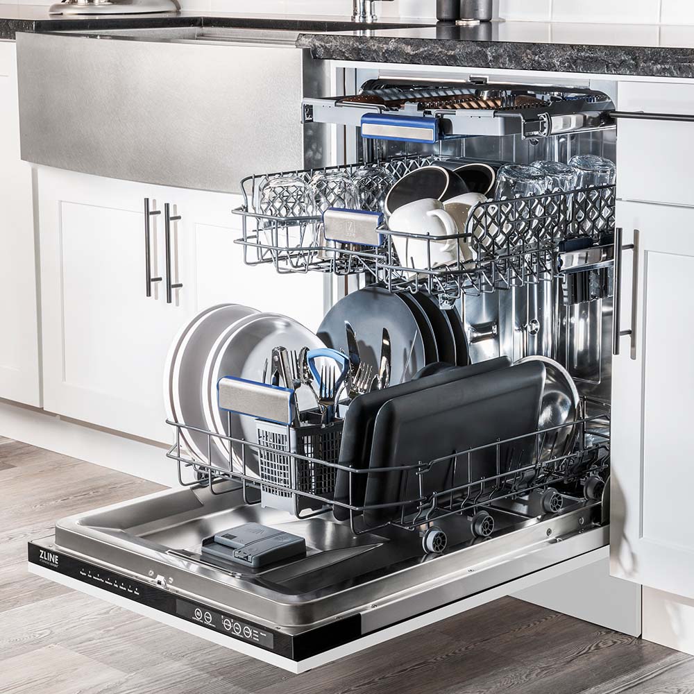 ZLINE 24 in. Tallac Series 3rd Rack Dishwasher with White Matte Panel and Traditional Handle, 51dBa (DWV-WM-24) side, open, in a luxury kitchen with dishes loaded on racks.