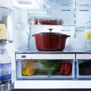 Food on adjustable shelving inside ZLINE French door refrigerator.