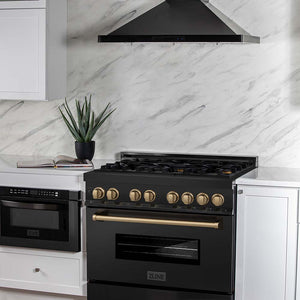 ZLINE Autograph Edition 36 in. 4.6 cu. ft. Legacy Dual Fuel Range with 6 Burner Gas Cooktop and Electric Convection Oven in Black Stainless Steel and Champagne Bronze Accents (RABZ-36-CB) in a luxury cottage-style kitchen with matching microwave and range hood.