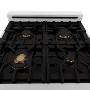 ZLINE brass burners on black porcelain cooktop with cast-iron grates.