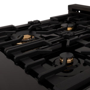 ZLINE brass burners on black porcelain cooktop with cast-iron grates.