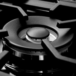 Close up of ZLINE sealed burner and cast-iron grates on cooktop.