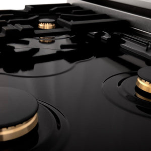 ZLINE Autograph Edition 24 in. 2.8 cu. ft. Legacy Dual Fuel Range with 4 Burner Gas Cooktop and Electric Convection Oven in Stainless Steel with White Matte Door and Polished Gold Accents (RAZ-WM-24-G) burners and cooktop.