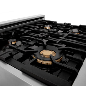 ZLINE brass burners on black porcelain cooktop with cast-iron grates.