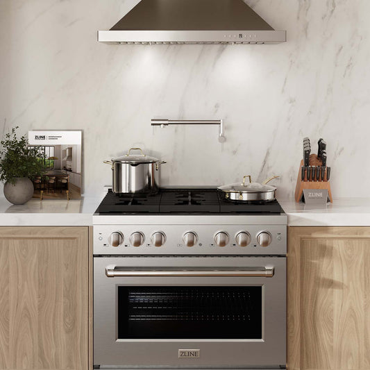 ZLINE 36 in. 5.2 cu. ft. Paramount Gas Range with 6 Burner Cooktop and Convection Gas Oven in Stainless Steel (SGR36) front, in a luxury kitchen.