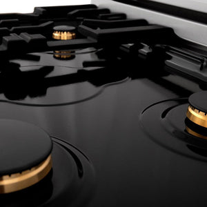 ZLINE brass burners on black porcelain cooktop with no grates.