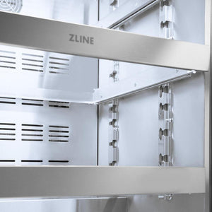 ZLINE Autograph Edition 24 in. Touchstone 151 Can Beverage Fridge With Panel Ready Glass Door And Champagne Bronze Handle (RBSPOZ-24-CB) front, middle full-extension glass racks with ZLINE logo close up.