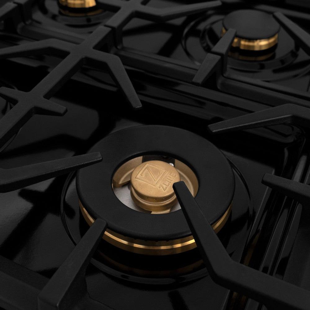 ZLINE brass burners, black porcelain cooktop, and high cast-iron grates close up.