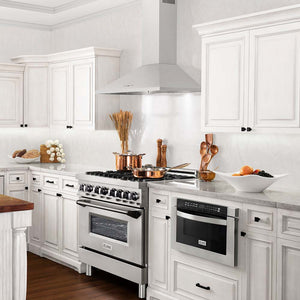ZLINE kitchen appliances in luxury farmhouse kitchen with white cabinets and countertops