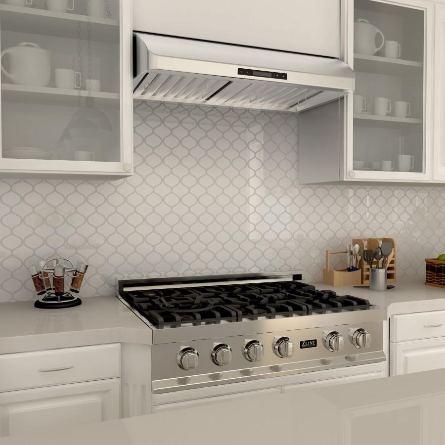 ZLINE Ducted Under Cabinet Range Hood in Stainless Steel (621) above a gas cooktop, side.