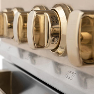 ZLINE Autograph Edition 36 in. 4.6 cu. ft. Legacy Dual Fuel Range with 6 Burner Gas Cooktop and Electric Convection Oven in Stainless Steel and Polished Gold Accents (RAZ-36-G) close-up, Polished Gold oven knob.