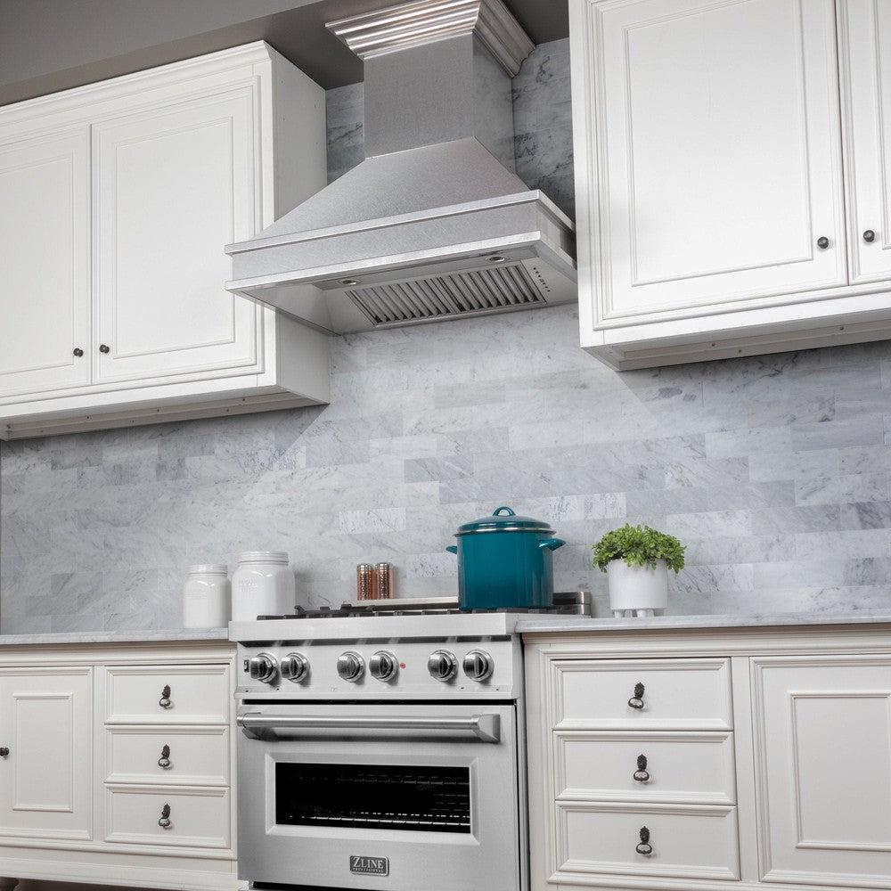 ZLINE Designer Series Fingerprint Resistant Wall Mount Range Hood (8656S) in a cottage-style kitchen from below.