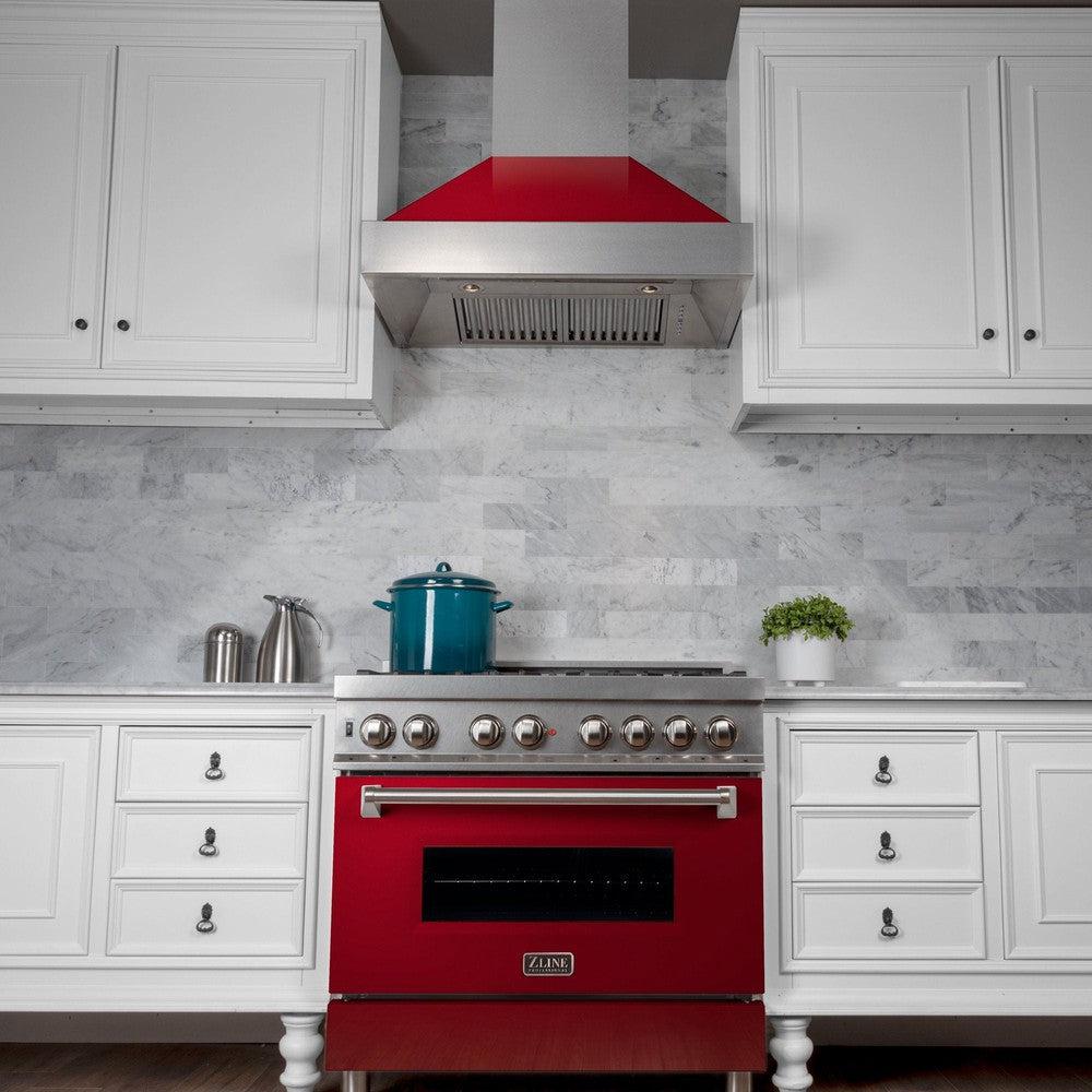 ZLINE Ducted Fingerprint Resistant Stainless Steel Range Hood with Red Gloss Shell (8654RG) in a luxury kitchen above matching range, below.