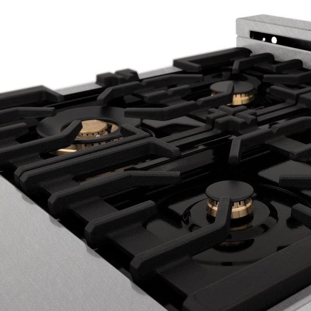 ZLINE brass burners on black porcelain cooktop with cast-iron grates.