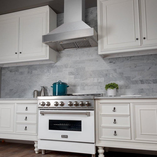 ZLINE Fingerprint Resistant Stainless Steel Range Hood (8654SN) above a range in a white kitchen.