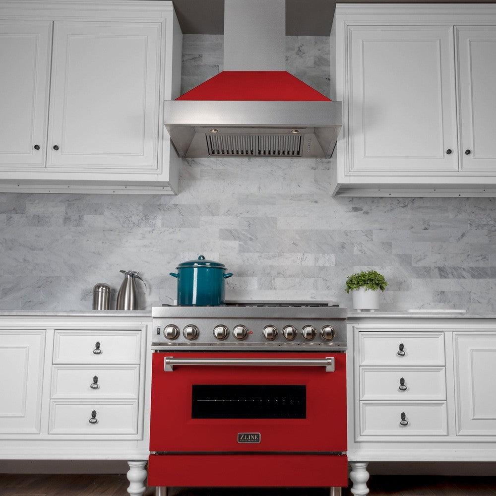 ZLINE Ducted Fingerprint Resistant Stainless Steel Range Hood with Red Matte Shell (8654RM) in a luxury kitchen, below.