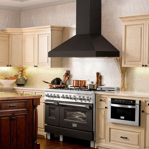 ZLINE Designer Series Wall Mount Range Hood in Oil-Rubbed Bronze (8667B) in a farmhouse-style kitchen above matching range.