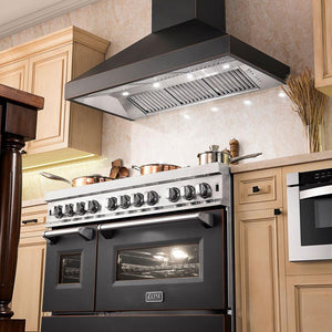 ZLINE Designer Series Wall Mount Range Hood in Oil-Rubbed Bronze (8667B) in a farmhouse-style kitchen from below.