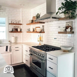 ZLINE Convertible Vent Outdoor Approved Wall Mount Range Hood in Stainless Steel (KB-304) in a compact cottage-style kitchen from side.