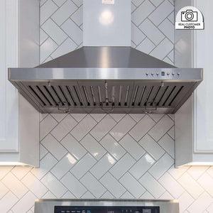 ZLINE Convertible Vent Outdoor Approved Wall Mount Range Hood in Stainless Steel (KB-304) in a luxury kitchen from front.