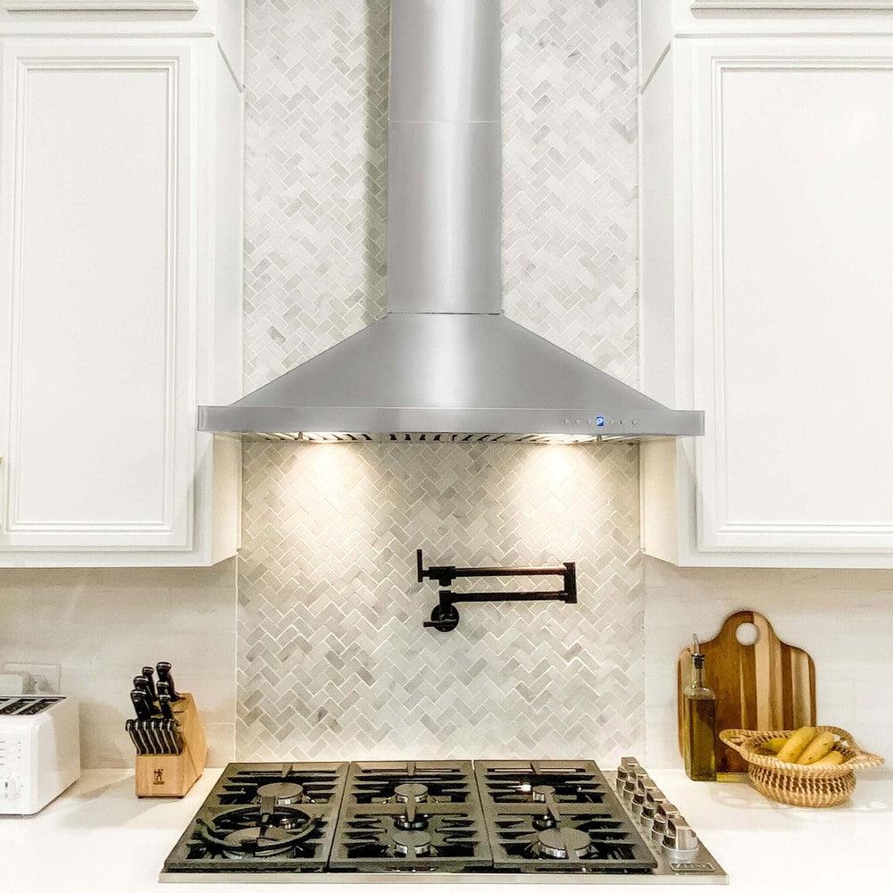 ZLINE Convertible Vent Outdoor Approved Wall Mount Range Hood in Stainless Steel (KB-304) in a farmhouse-style kitchen with white cabinets.