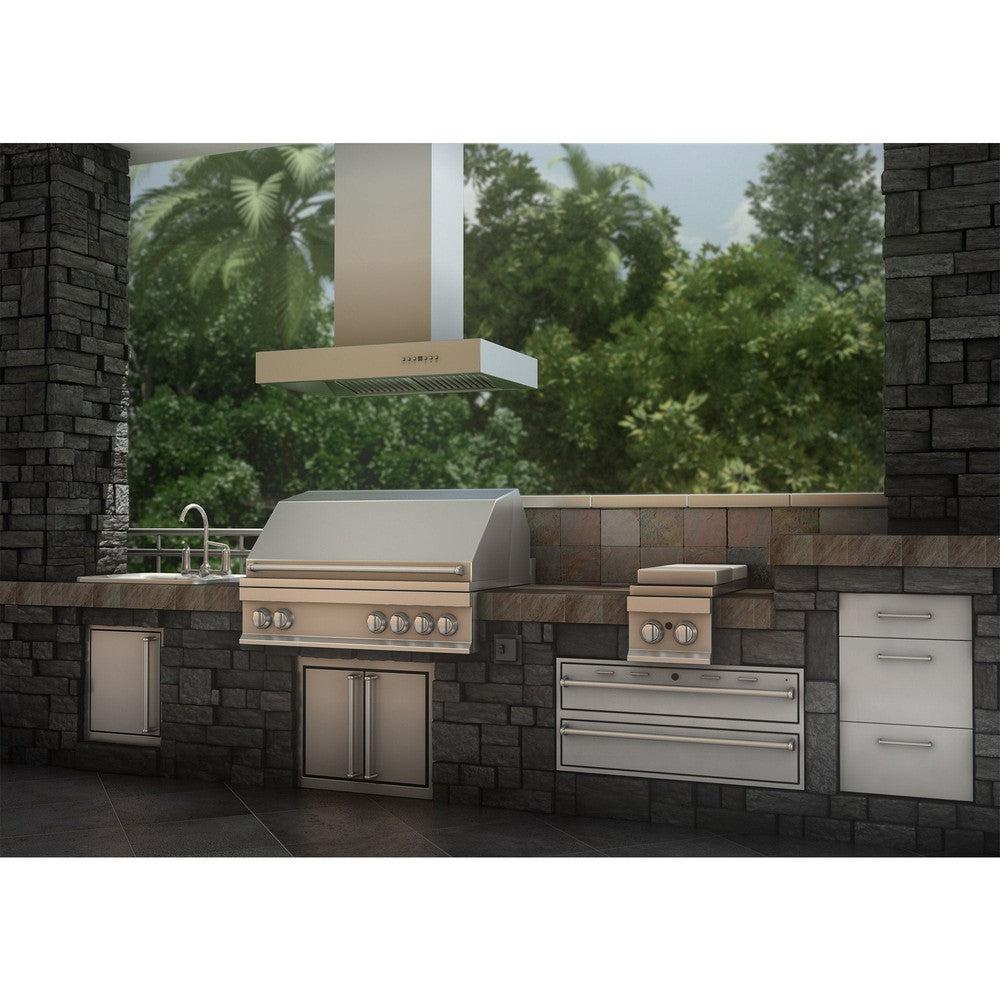 ZLINE Ducted Outdoor Island Mount Range Hood in Stainless Steel (KECOMi-304) rendering outside above barbecue in a stone patio kitchen.