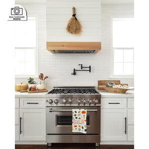 ZLINE Ducted Island Mount Range Hood Insert in Stainless Steel (721i) in a custom range hood in a farmhouse kitchen