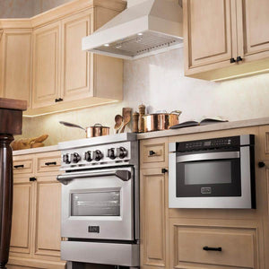 ZLINE Ducted Wooden Wall Mount Range Hood in Cottage White (KBTT) above a stainless steel range