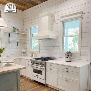 ZLINE Ducted Wooden Wall Mount Range Hood in Cottage White (KBTT) in a cottage-style kitchen